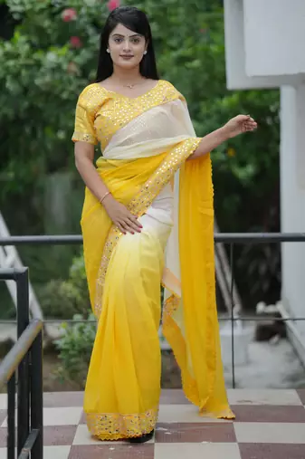 Yellow faux georgette fabric beautiful padding saree with smart and trendy mirror work