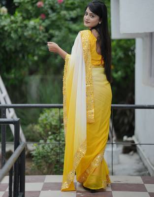Yellow faux georgette padding saree with smart and trendy mirror work 2