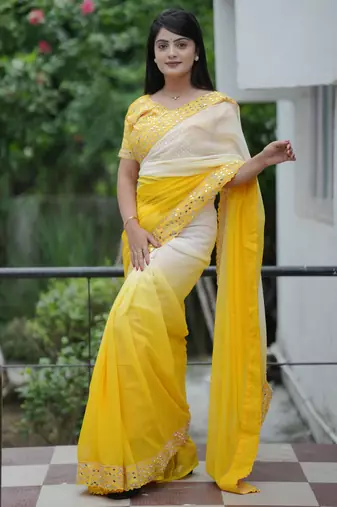 Yellow faux georgette padding saree with smart and trendy mirror work