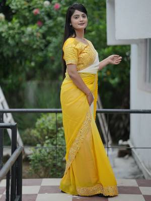 Yellow faux georgette padding saree with smart and trendy mirror work 5