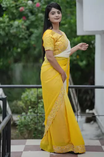 Yellow faux georgette padding saree with smart and trendy mirror work