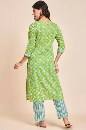 Green v neck tunic with striped palazzo co ords