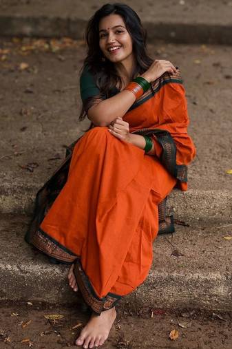 Orange dark green blended cotton woven zari work saree with blouse