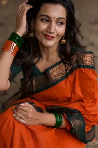 Orange dark green blended cotton woven zari work saree with blouse