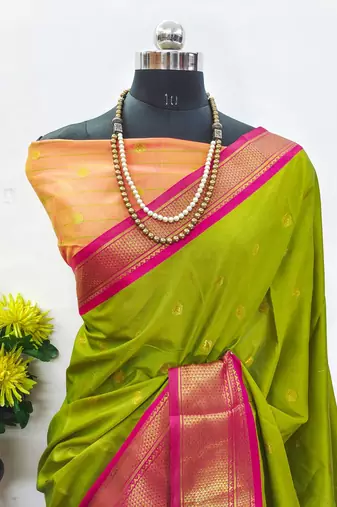 Dark green pure silk woven zari work saree with blouse