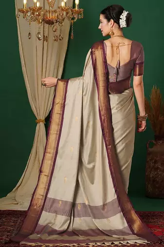 Beige blended cotton woven zari work saree with blouse