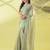 Dark green chiffon woven zari work saree with blouse