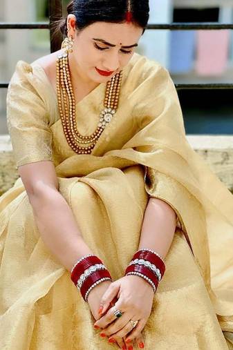 Beige gold tissue woven zari work saree with blouse