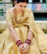 Beige gold tissue woven zari work saree with blouse
