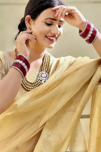 Beige gold tissue woven zari work saree with blouse
