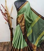 Dark green pure cotton woven zari work saree with blouse