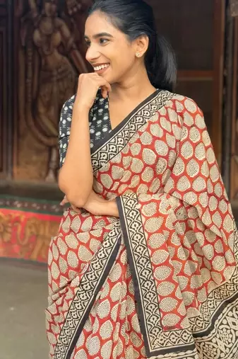 Orange linen printed zari work saree with blouse