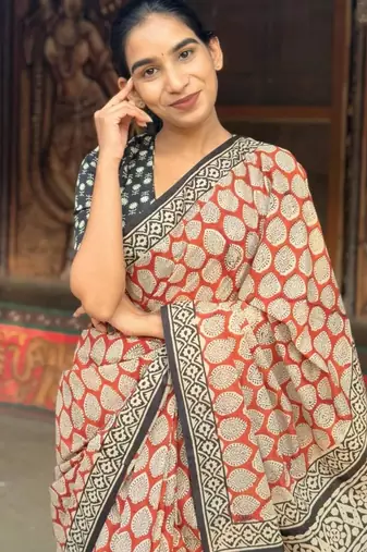 Orange linen printed zari work saree with blouse