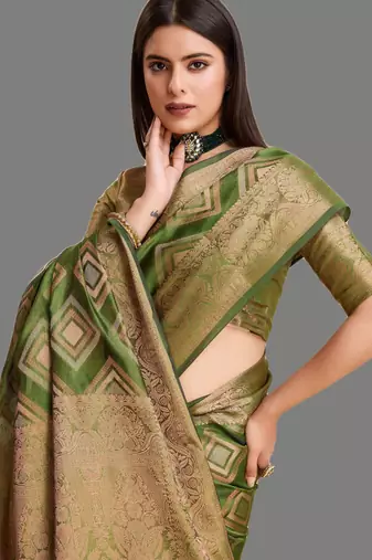 Dark green organza woven zari work saree with blouse