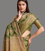 Dark green organza woven zari work saree with blouse