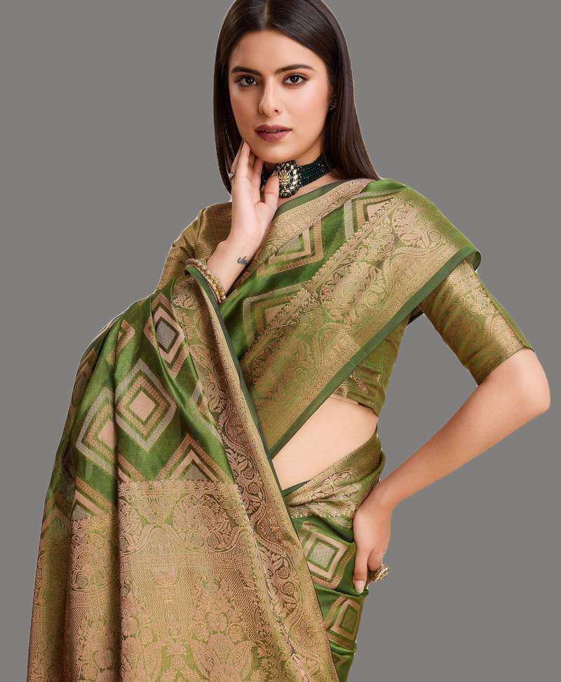 Dark green organza woven zari work saree with blouse