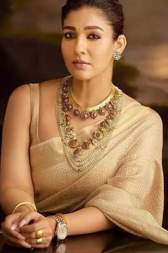Beige tissue woven zari work saree with blouse