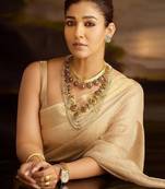 Beige tissue woven zari work saree with blouse