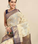 Cream dark blue tissue woven zari work saree with blouse