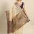 Cream dark blue tissue woven zari work saree with blouse