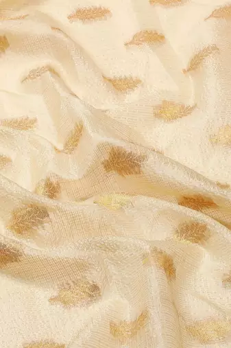 Cream dark blue tissue woven zari work saree with blouse