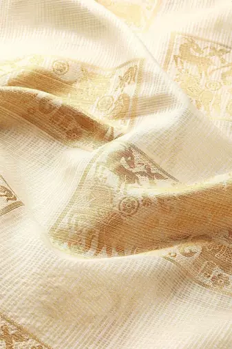 Cream gold tissue woven zari work saree with blouse