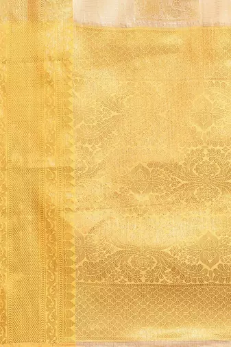 Cream gold tissue woven zari work saree with blouse