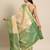 Cream green tissue woven zari work saree with blouse