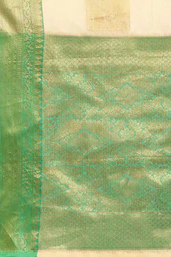 Cream green tissue woven zari work saree with blouse