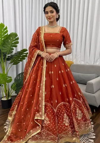 Rust silk blend thread embroidered  Lehenga & Unstitched Blouse with Dupatta