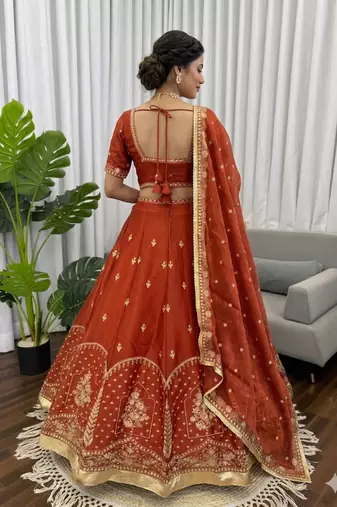 Rust silk blend thread embroidered  Lehenga & Unstitched Blouse with Dupatta