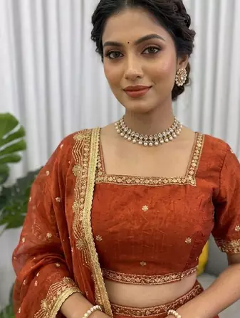 Rust silk blend thread embroidered  Lehenga & Unstitched Blouse with Dupatta