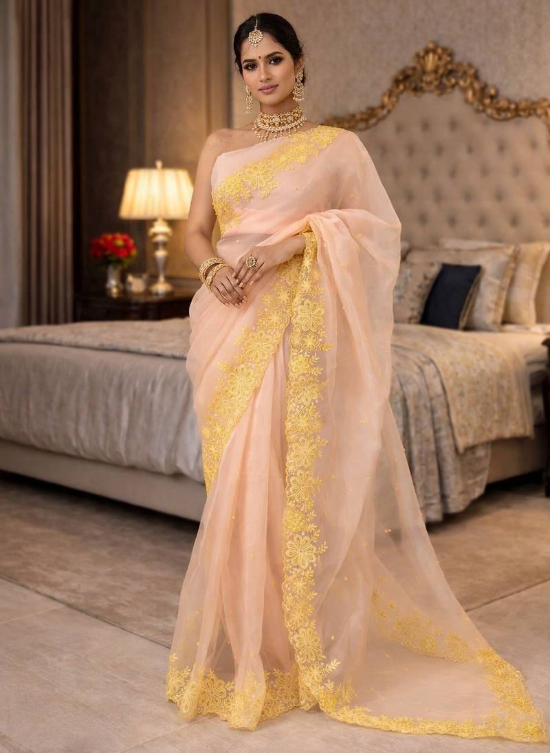 peach emboidered cut work organza saree with blouse