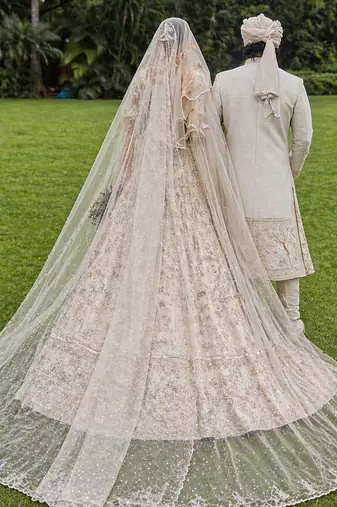 Ivory Embroidered Tulle Lehenga Set With Veil