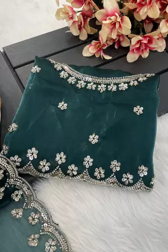 Teal green heavy embroidered real moti with sequin embroidered zimmy choo silk saree with blouse