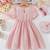 Peach embellished textured fabric bow style girls dress