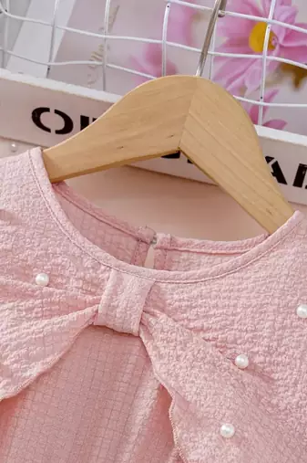 Peach embellished textured fabric bow style girls dress