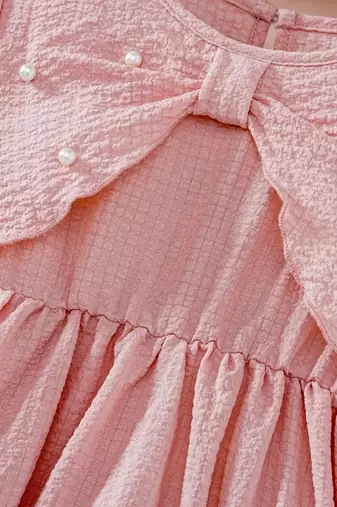 Peach embellished textured fabric bow style girls dress