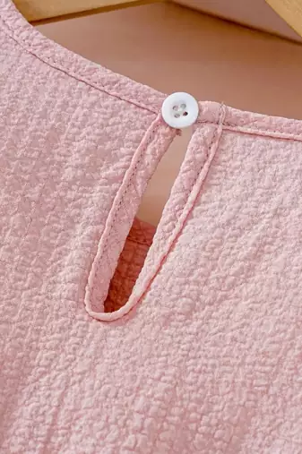 Peach embellished textured fabric bow style girls dress