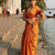  orange glow orange handloom tissue saree