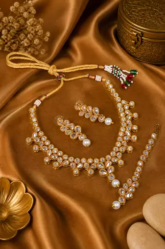 Gold plated white kundan embellished necklace set