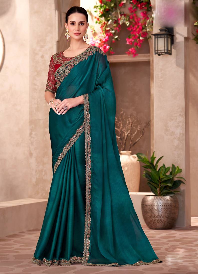 Dark teal chiffon embroidered saree with unstitched blouse piece