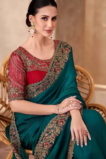 Dark teal chiffon embroidered saree with unstitched blouse piece