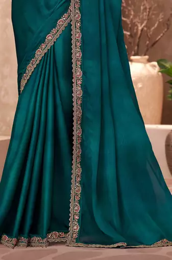 Dark teal chiffon embroidered saree with unstitched blouse piece