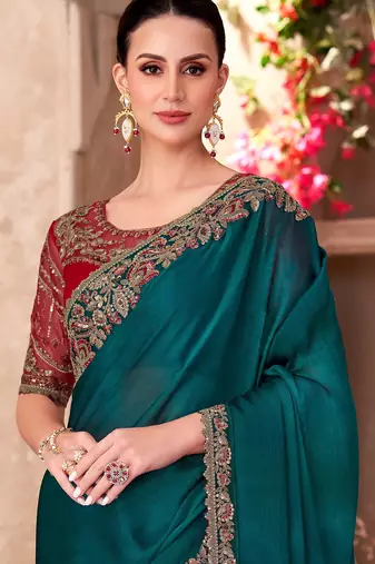 Dark teal chiffon embroidered saree with unstitched blouse piece