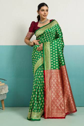 Green banarasi art silk blend zari woven saree with unstitched blouse piece