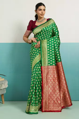 Green banarasi art silk blend zari woven saree with unstitched blouse piece