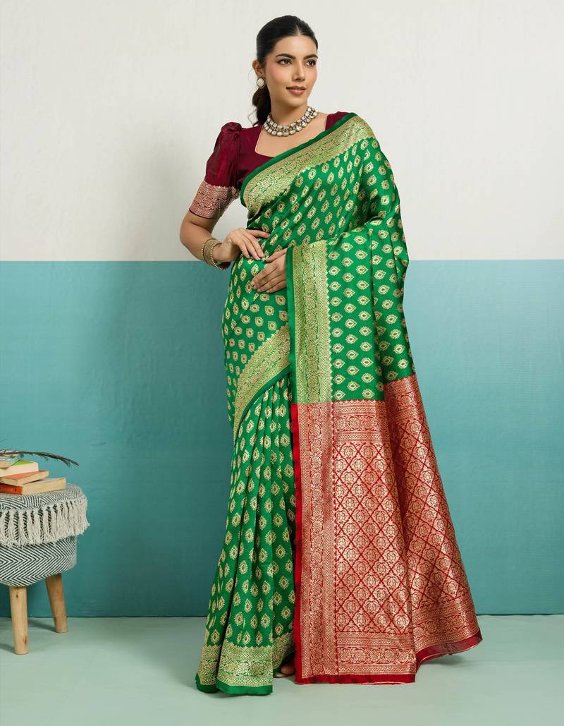 Green banarasi art silk blend zari woven saree with unstitched blouse piece
