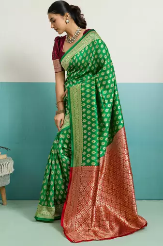 Green banarasi silk blend zari woven saree with unstitched blouse piece