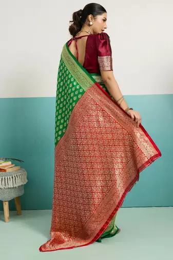 Green banarasi silk blend zari woven saree with unstitched blouse piece
